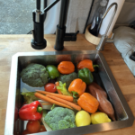 Fresh produce in a van kitchen sink